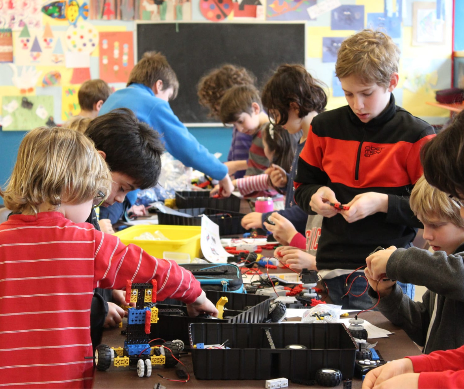 young kids building a robot