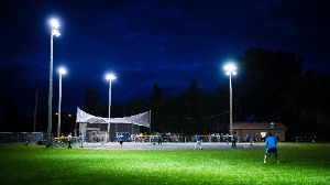 People playing softball at night