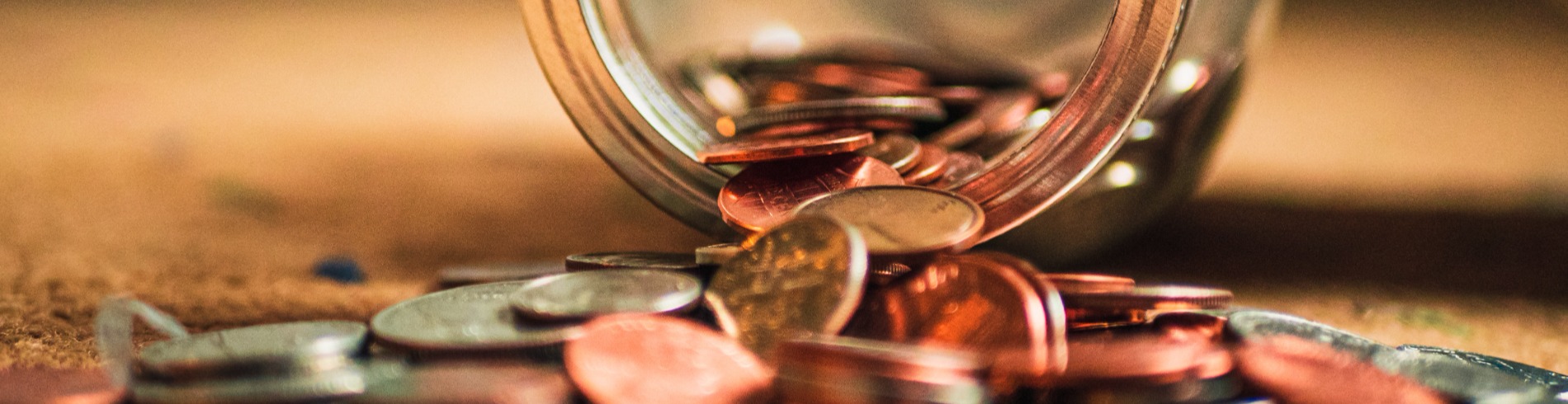 Coins falling out of jar