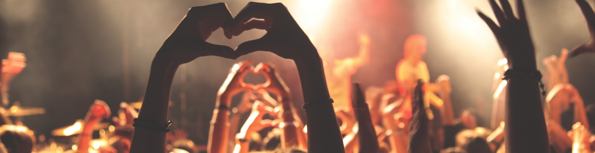 hands in the air at a concert