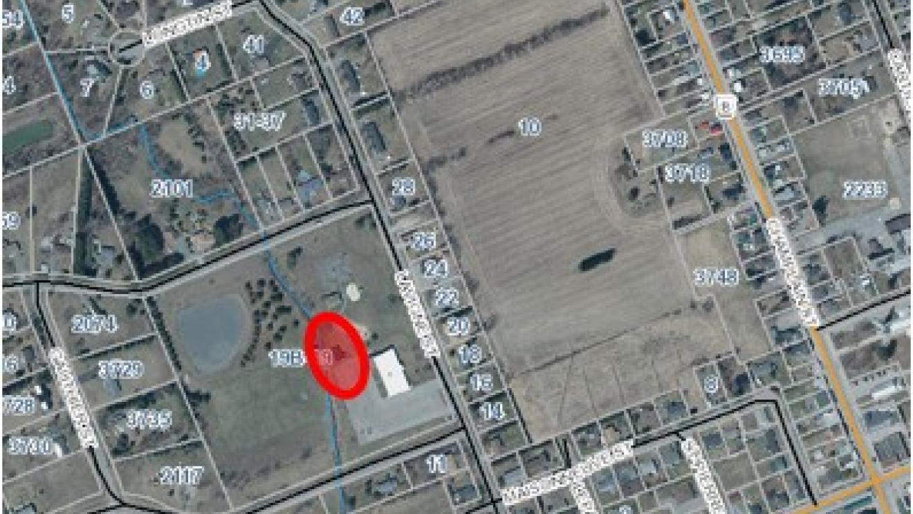 Satellite map with a red marker on accessory building at Bourget Community Centre
