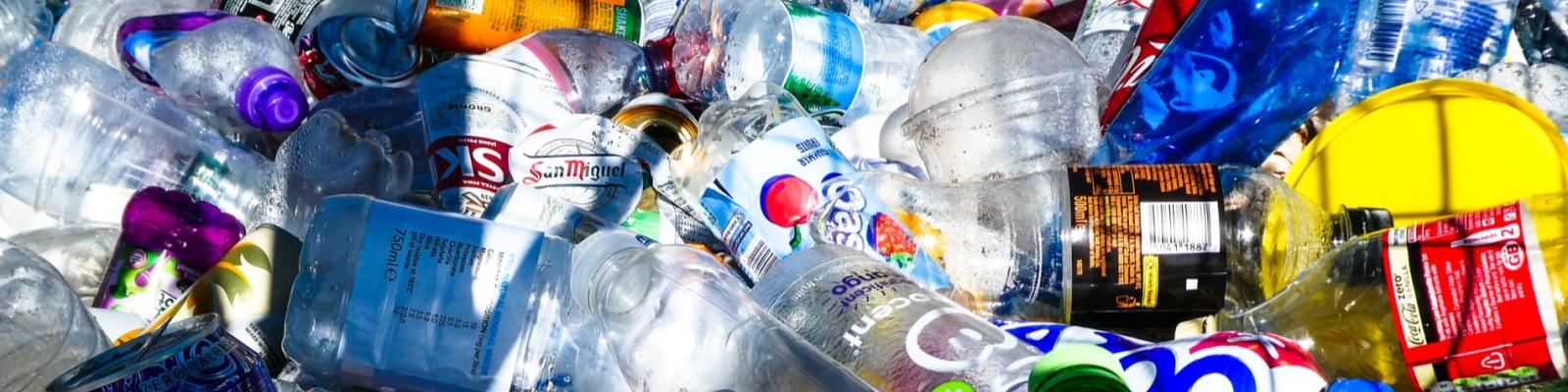 Plastic bottles and containers piled together.